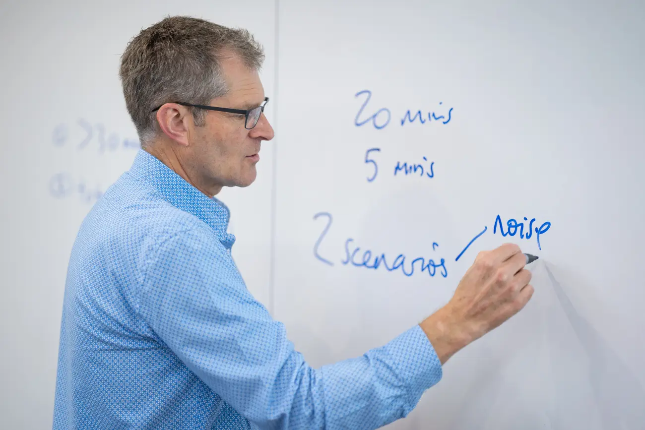 Glenn teaching at whiteboard.