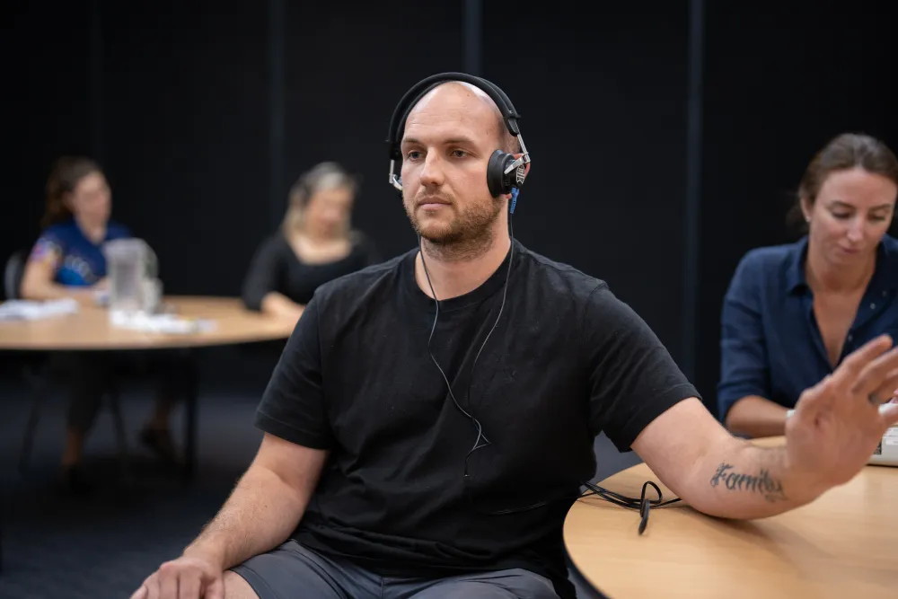 Participants conducting a hearing test