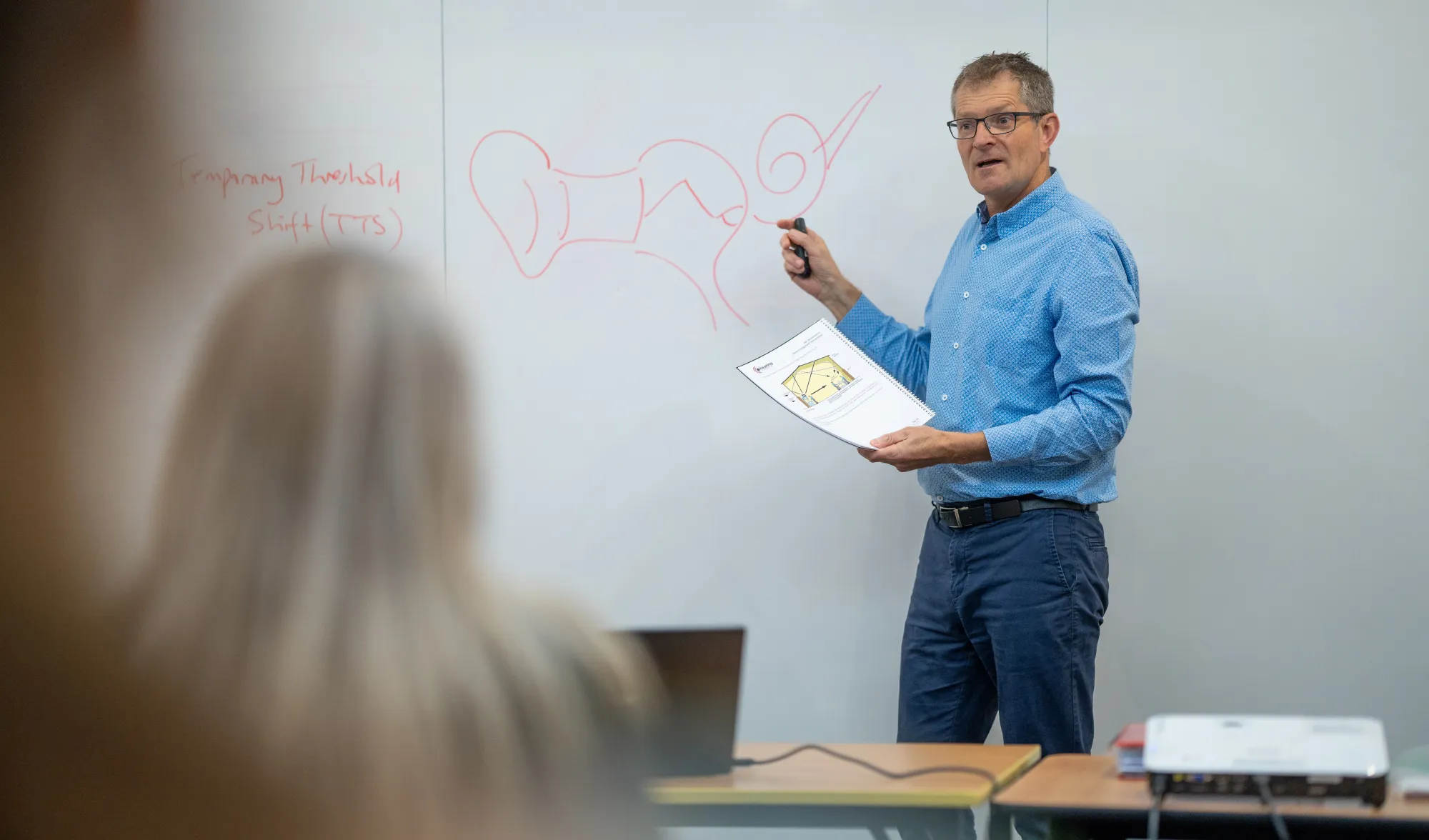 Glenn teaching students in a classroom