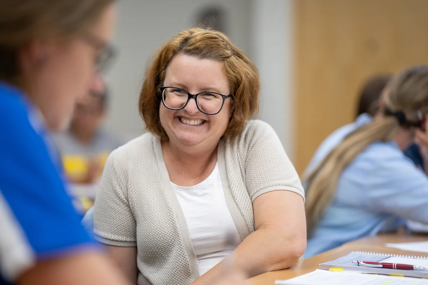 Participant smiling at another