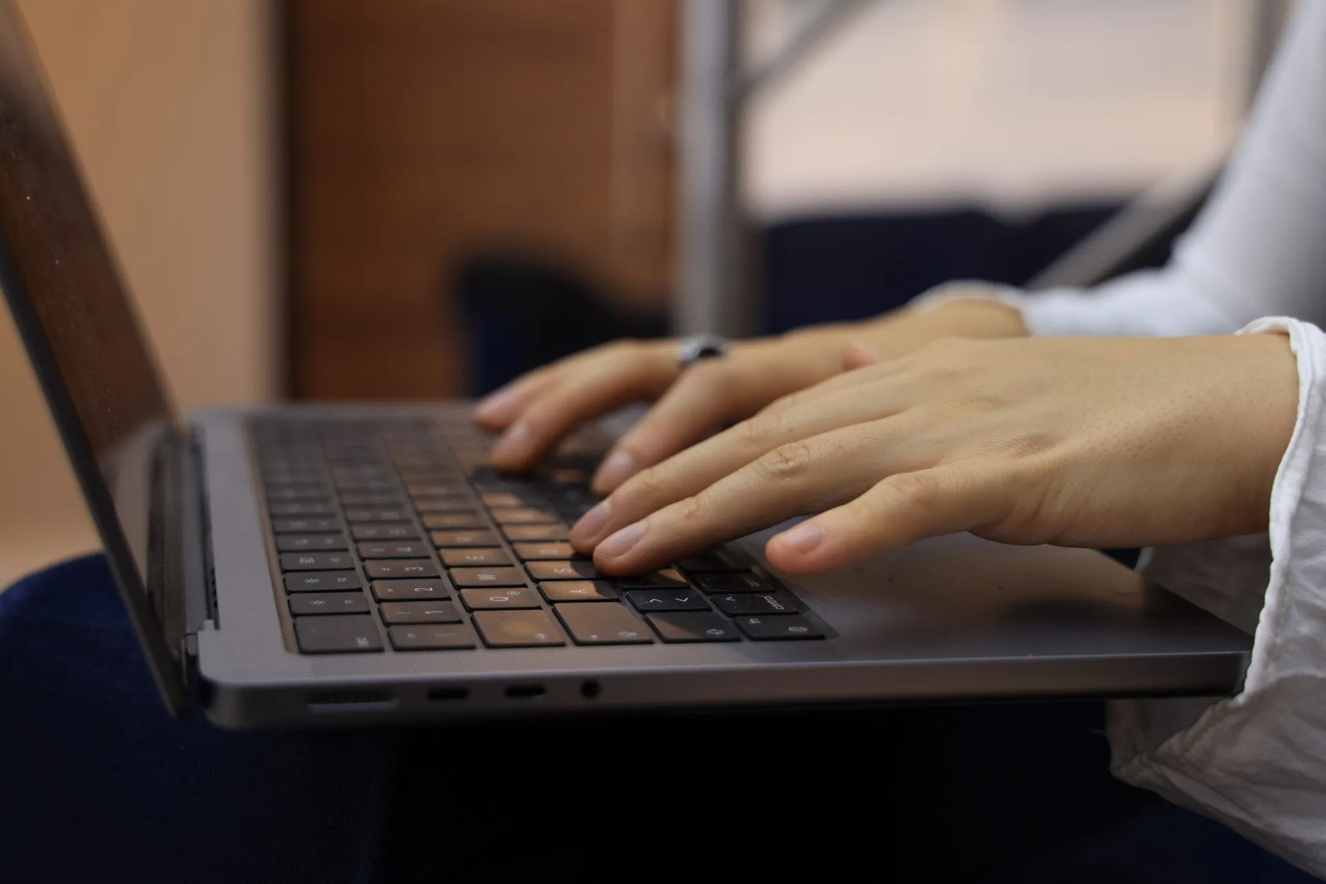 Someone typing on a laptop
